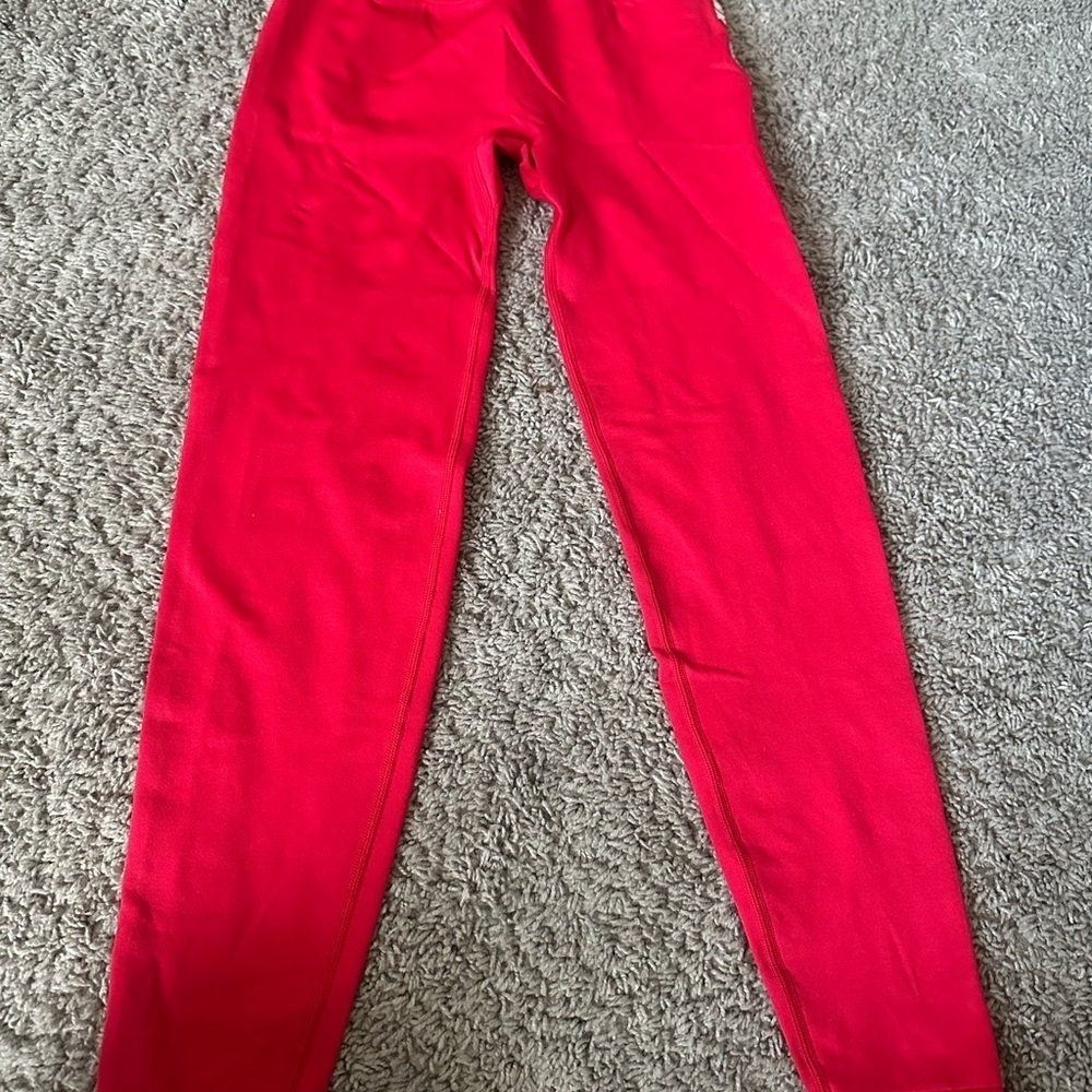 Gently used women red leggings.